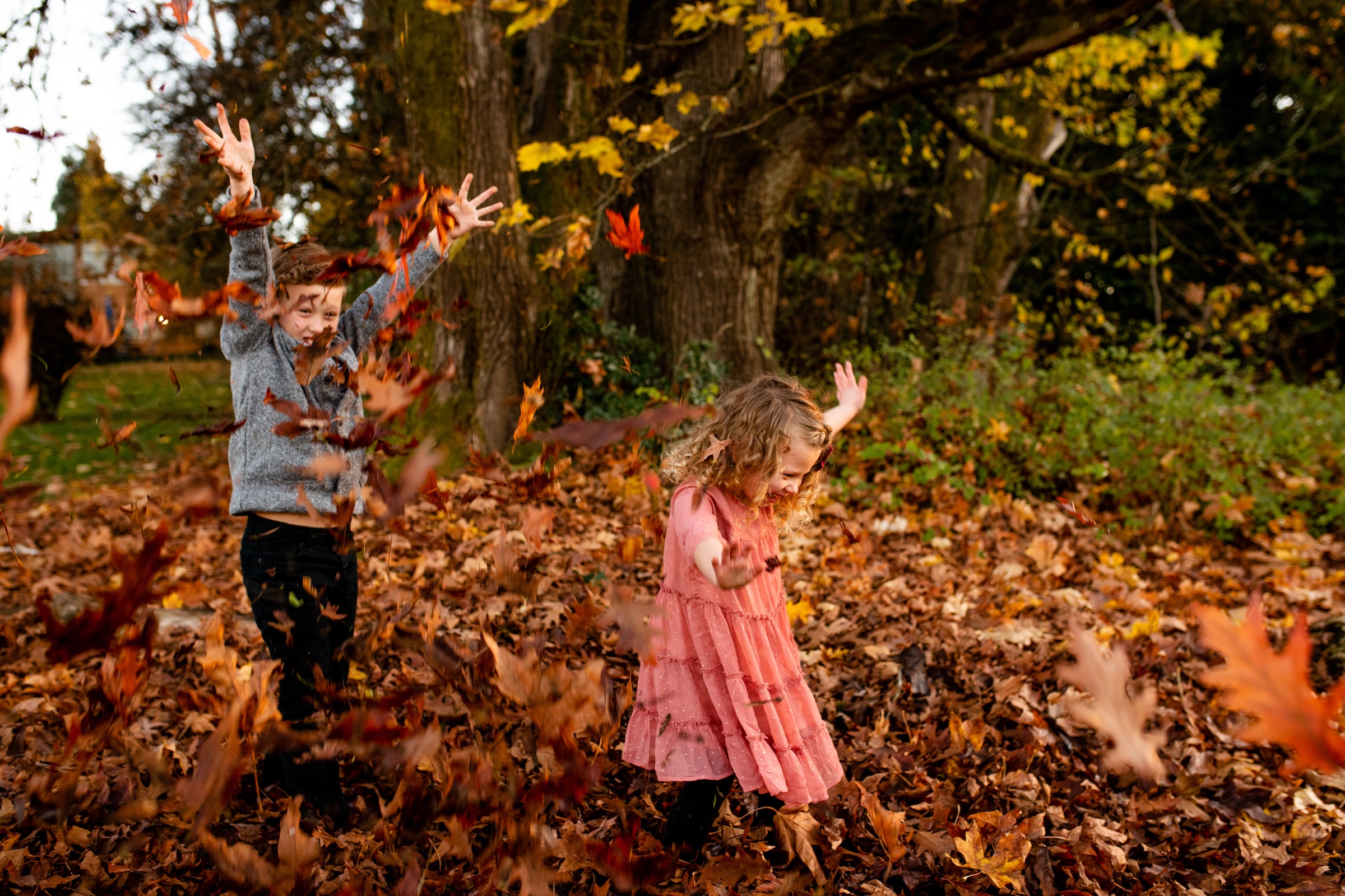 Young family laughing together outdoors